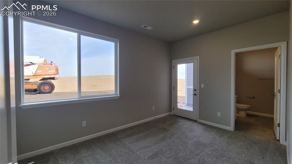 Image 4 of 28: Junior Suite at entry level with a 3/4 bathroom and private patio!