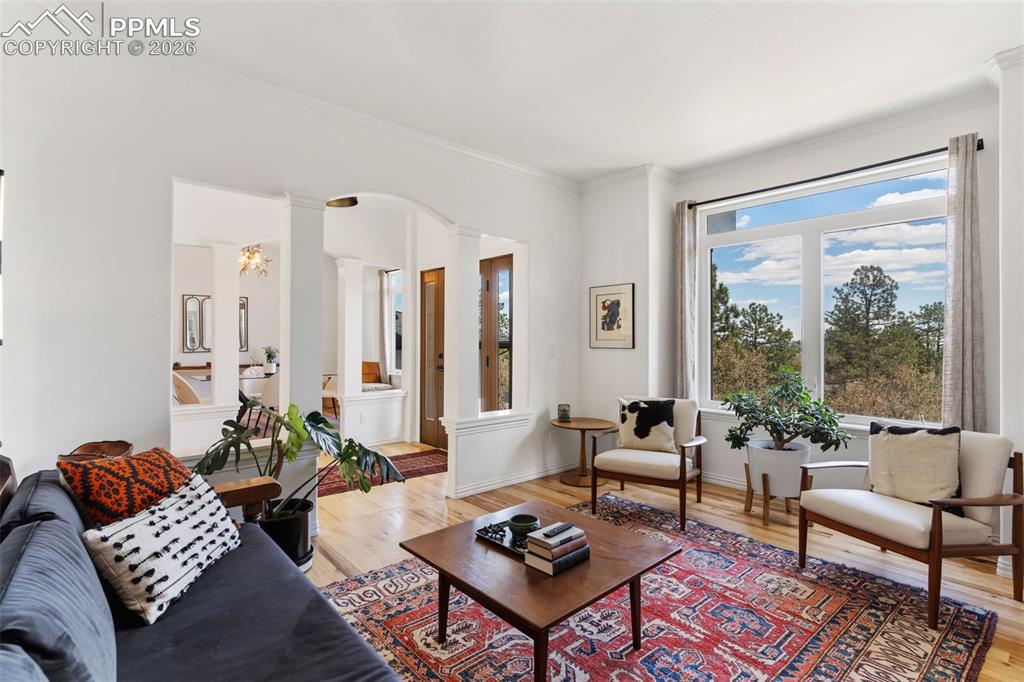 Image 10 of 49: Beautiful sitting room or den right off the foyer