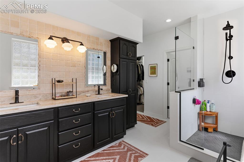 Image 23 of 49: Beautifully remodeled primary bath with spa shower, Taj Majal quartzite cou