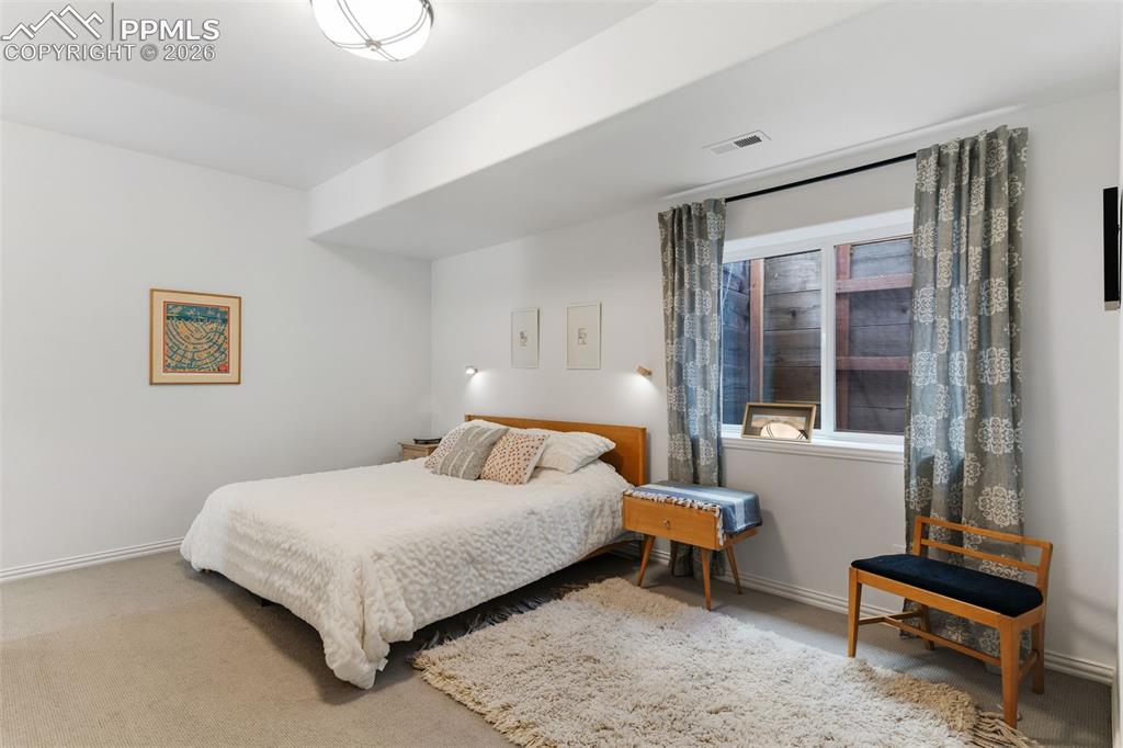 Image 32 of 49: Large basement bedroom w/ a nice walk-in closet & an adjoining Jack & Jill 