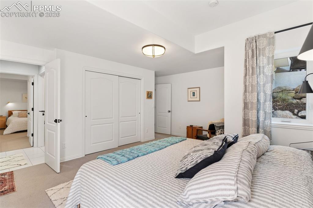 Image 34 of 49: Basement bedroom with large closet, separate sink area & a shared Jack & Ji