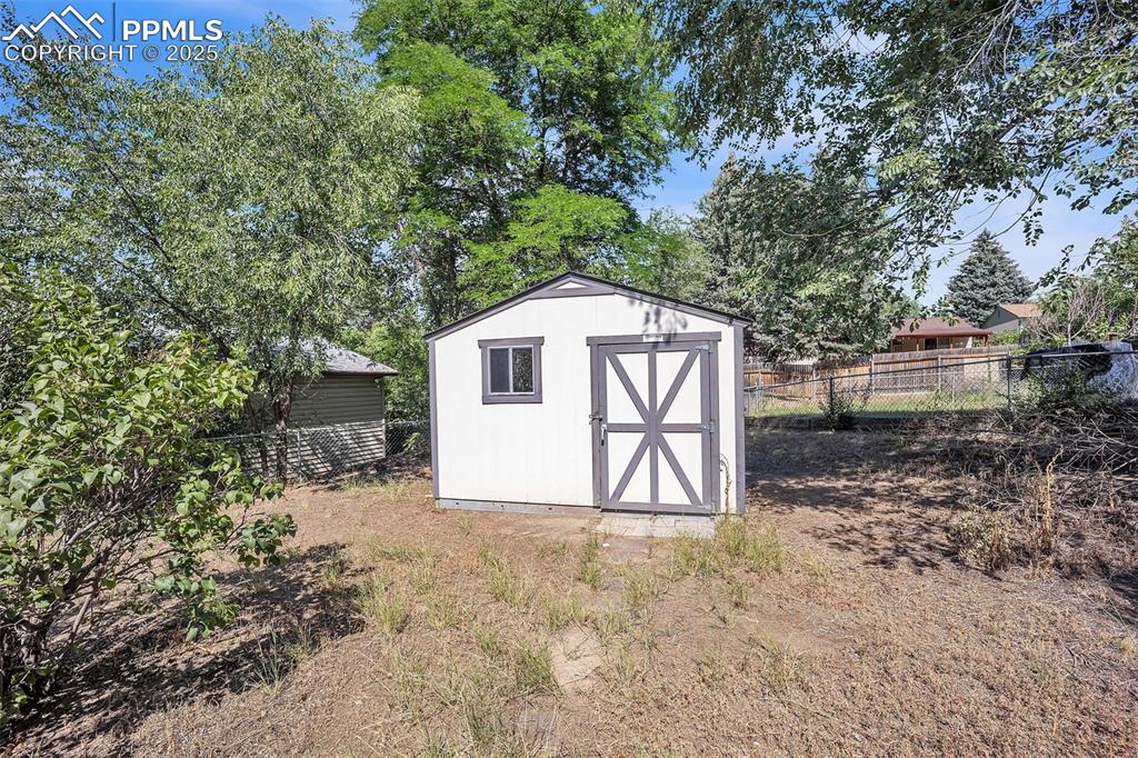 Image 6 of 34: Large storage shed is included!