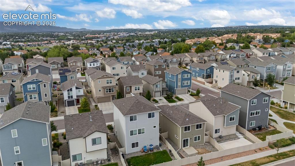 Image 26 of 32: Residential neighborhood with varied architectural styles, asphalt shingle
