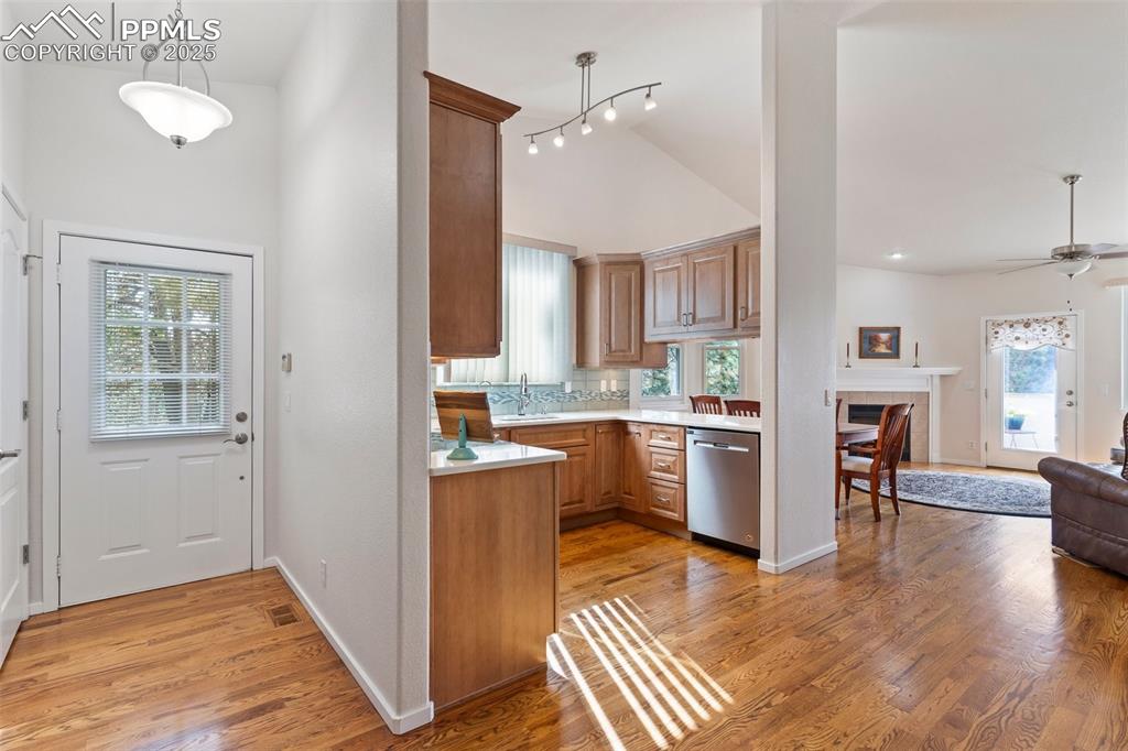 Image 8 of 30: Extensive Hardwoods throughout the foyer, kitchen and living room