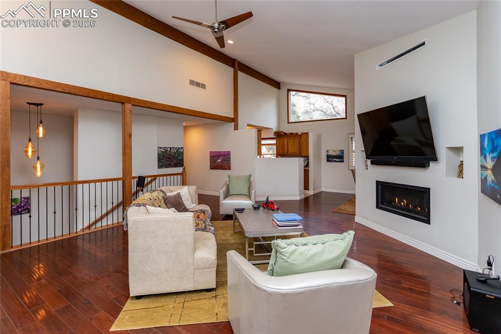 Image 12 of 45: The living room is open to the dining room & kitchen for an easy entertaini