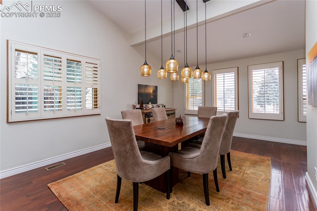 Image 13 of 45: Large, open, light filled dining room with stunning light fixture. Plenty o
