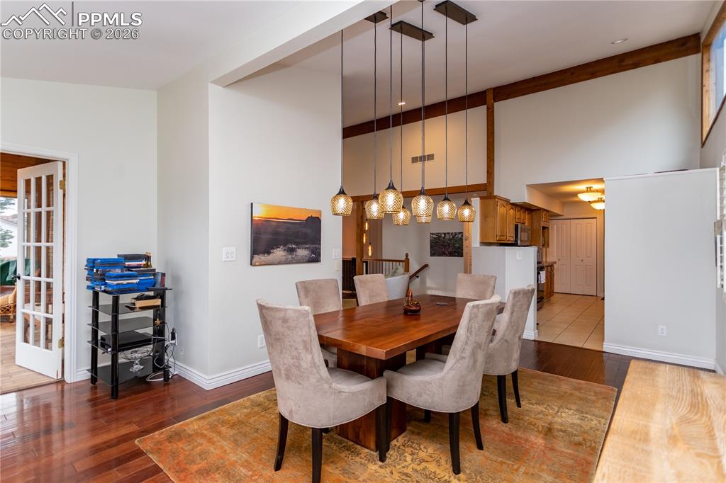 Image 14 of 45: Wonderful flow from the living room, the kitchen & the sunroom.  An enterta