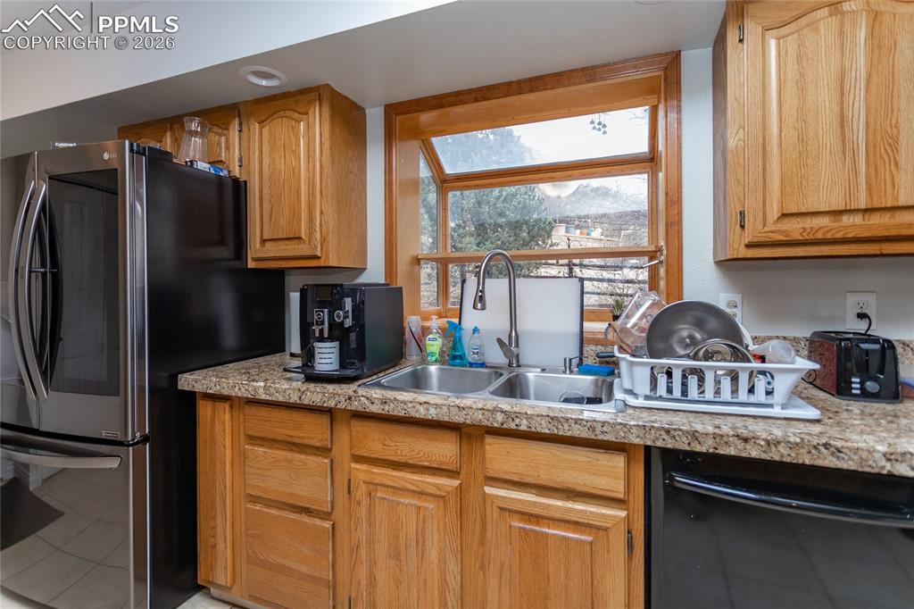 Image 18 of 45: A sunny garden window in the kitchen is perfect for your indoor herb garden