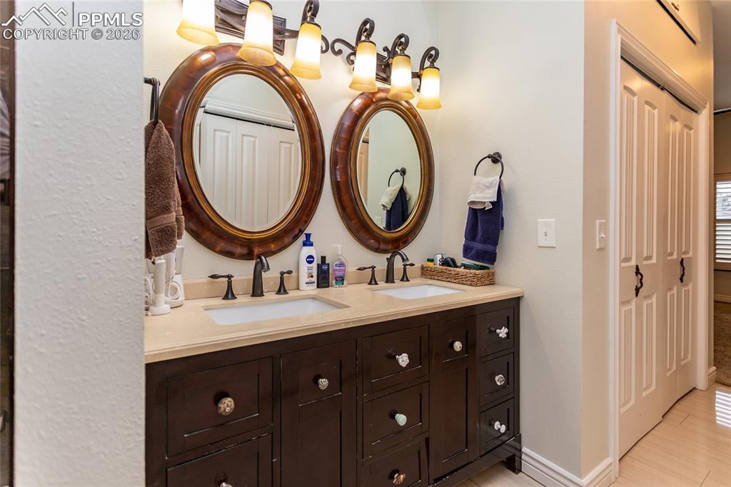 Image 28 of 45: Outstanding lighting & plenty of room in the primary bath.