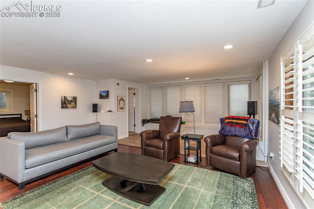 Image 32 of 45: Stretch out in the spacious family room. Plenty of room for game night or w