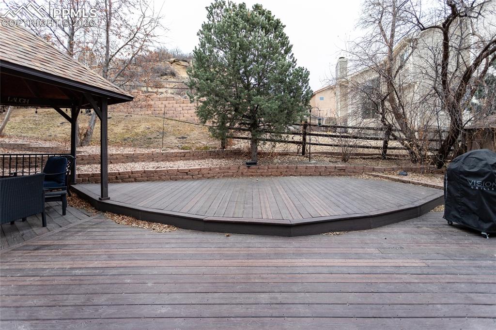 Image 39 of 45: The huge, private, back yard oasis & deck area is surrounded by natural veg