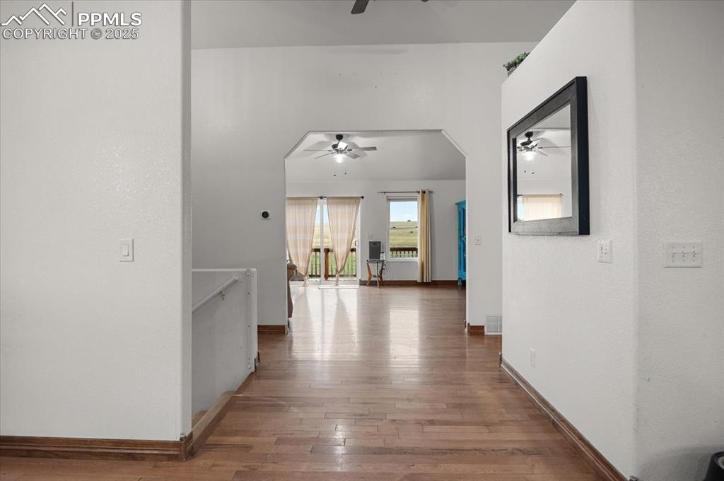 Image 2 of 38: Hall with hardwood / wood-style floors and baseboards