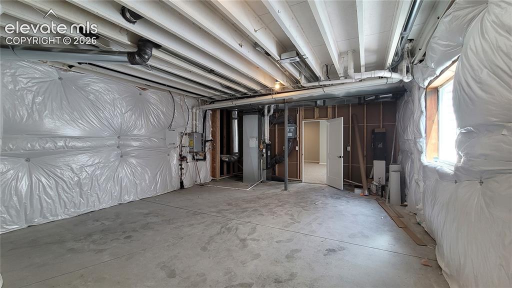 Image 46 of 50: Storage/Utility room with a tankless water heater, 96% energy efficient fur
