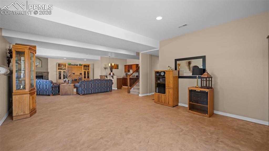 Image 37 of 47: Family room offers multiple options, perfect for a game room!
