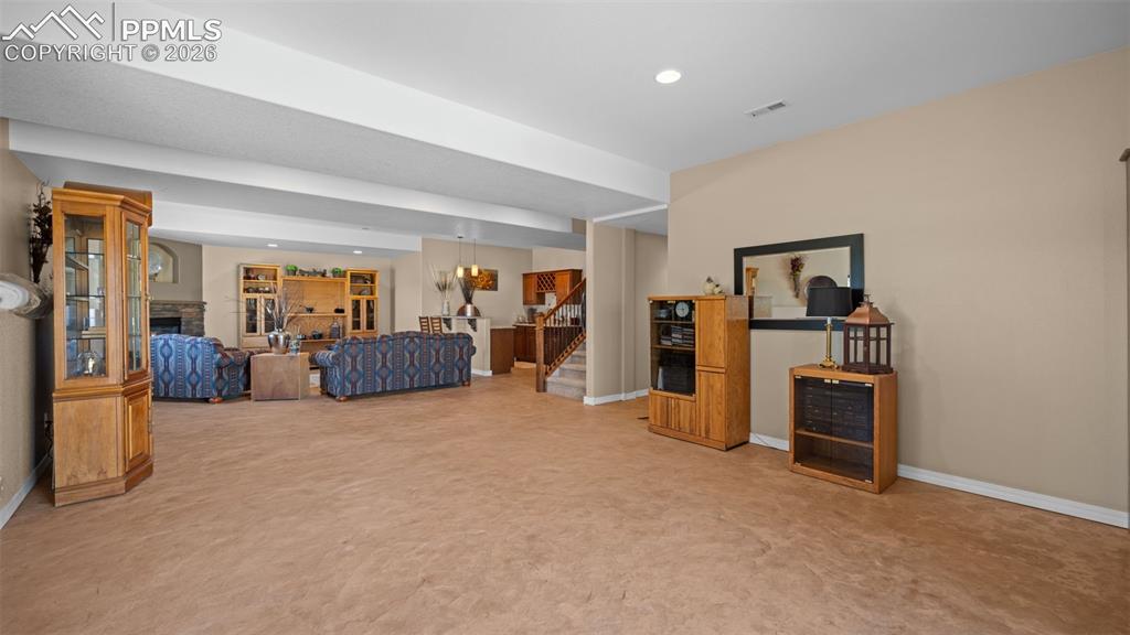 Image 38 of 50: Family room offers multiple options, perfect for a game room!