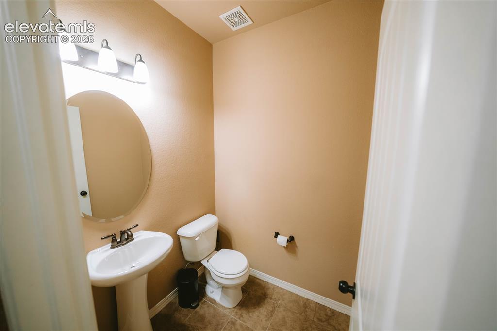 Image 13 of 30: Main Level Half-Bathroom