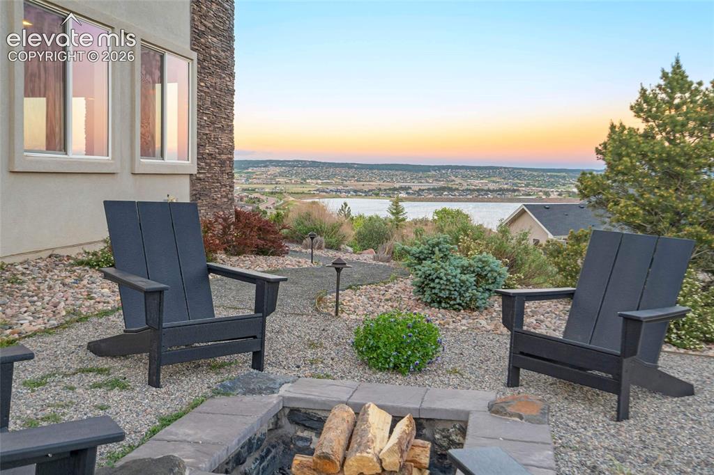 Image 15 of 50: Firepit area with lake views