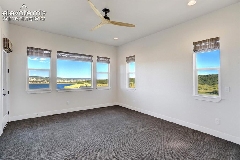 Image 26 of 50: Owner Suite with lake views on three sides