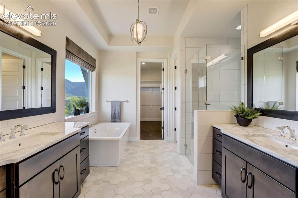Image 27 of 50: Owner Bathroom with natural light