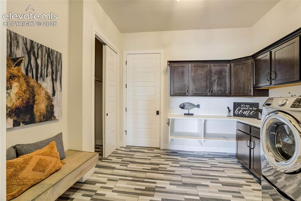 Image 34 of 50: Main floor laundry / mudroom entry from garage