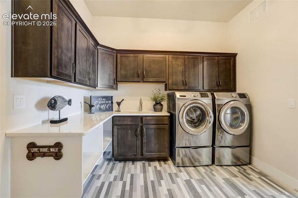 Image 35 of 50: Main floor laundry/mudroom