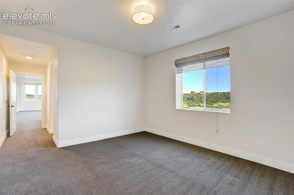 Image 42 of 50: Bedroom #3 with mountain views