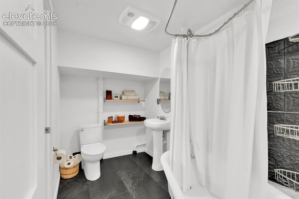 Image 16 of 33: Basement full bathroom