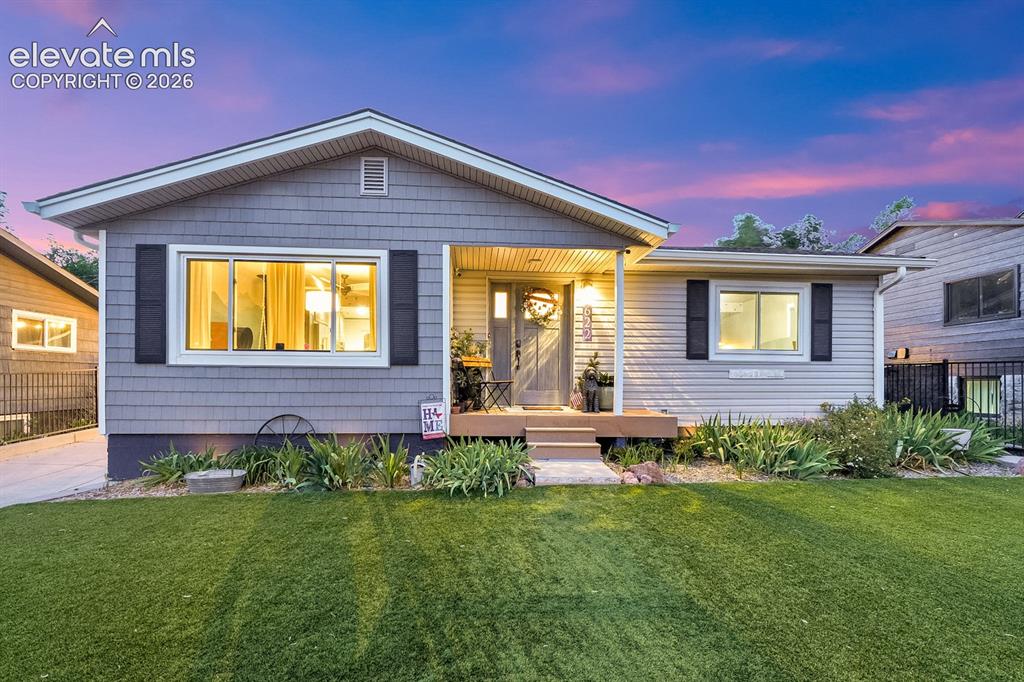 Image 29 of 33: Exterior featuring gray shingle siding, white trim, black louvered shutters
