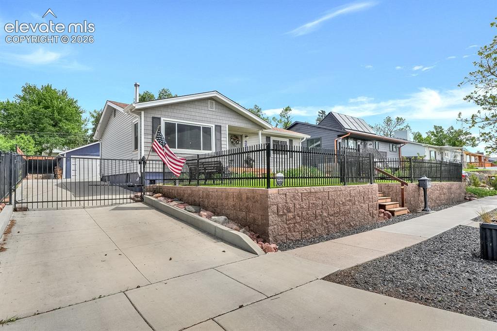 Image 31 of 33: Light gray siding exterior with a dark gray shingle roof