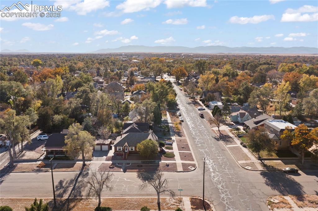 Image 2 of 28: Aerial view of residential area with mountains