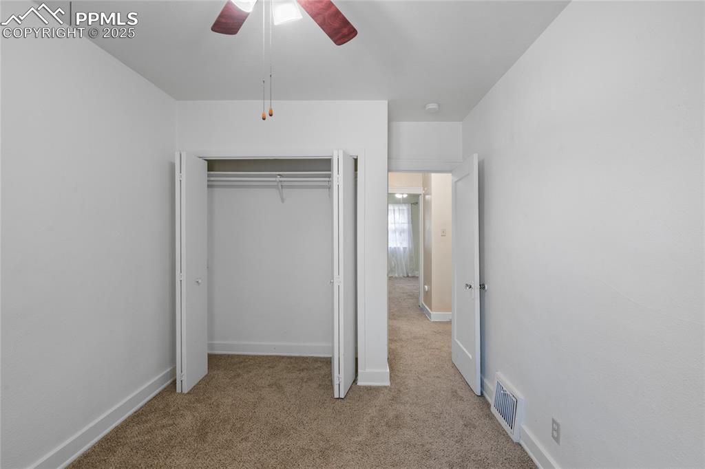 Image 20 of 28: Unfurnished bedroom featuring light colored carpet, a closet, and a ceiling