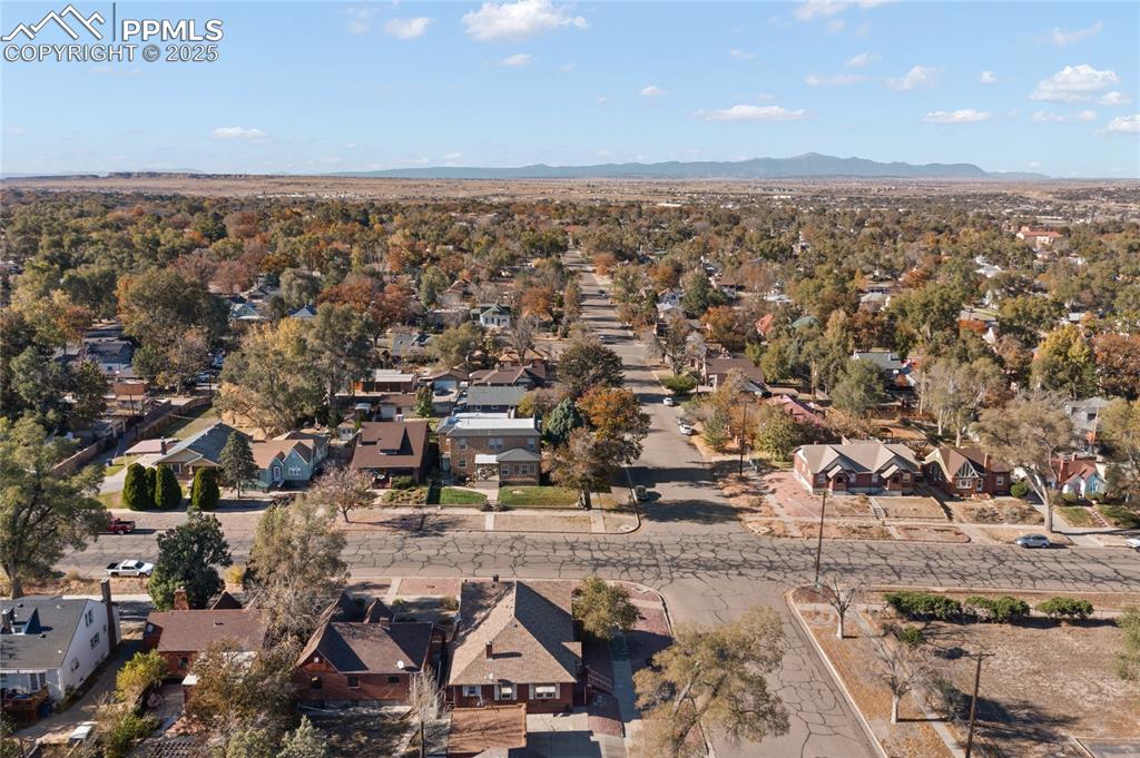Image 27 of 28: Aerial view of property and surrounding area featuring nearby suburban area