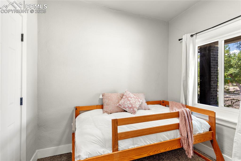Image 11 of 13: Carpeted bedroom featuring baseboards