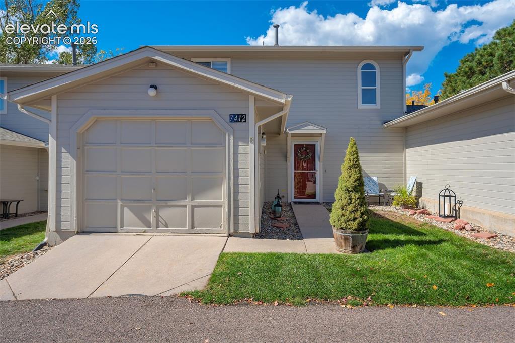 Image 32 of 50: Exterior featuring a single-car garage, concrete driveway, and a paved walk