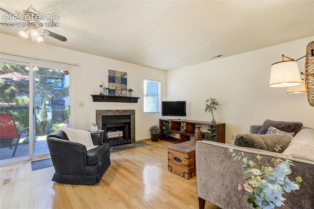 Image 4 of 50: Great Room, Wood Burning Fireplace, Walk-Out Access