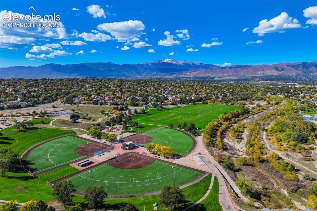 Image 45 of 50: Expansive recreational grounds featuring multiple baseball fields, a large