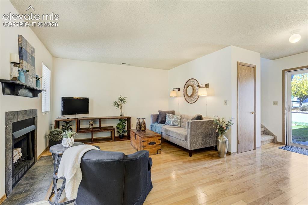 Image 6 of 50: Light wood-finish flooring throughout the space