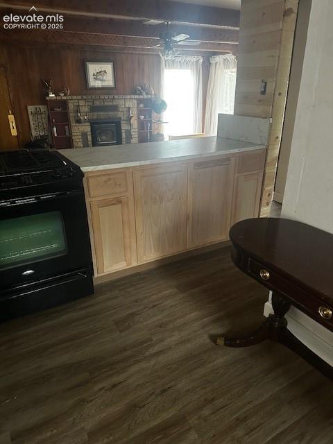Image 29 of 36: Kitchen counter with light wood cabinetry and a light-toned countertop, fea