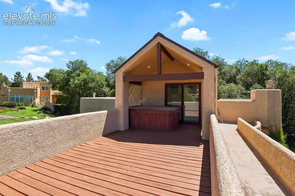 Image 18 of 39: Upper deck with hot tub