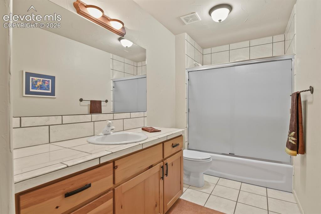 Image 21 of 39: Lower level full bath
