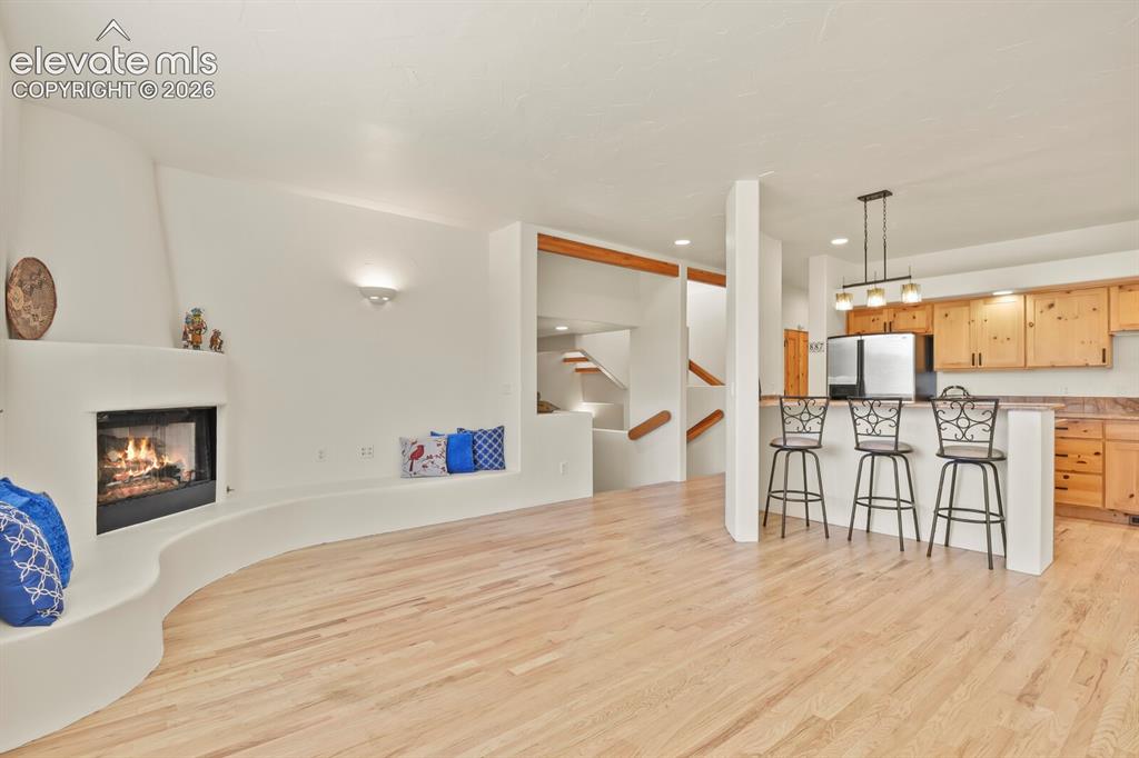 Image 8 of 39: Open floor plan with hardwood floors