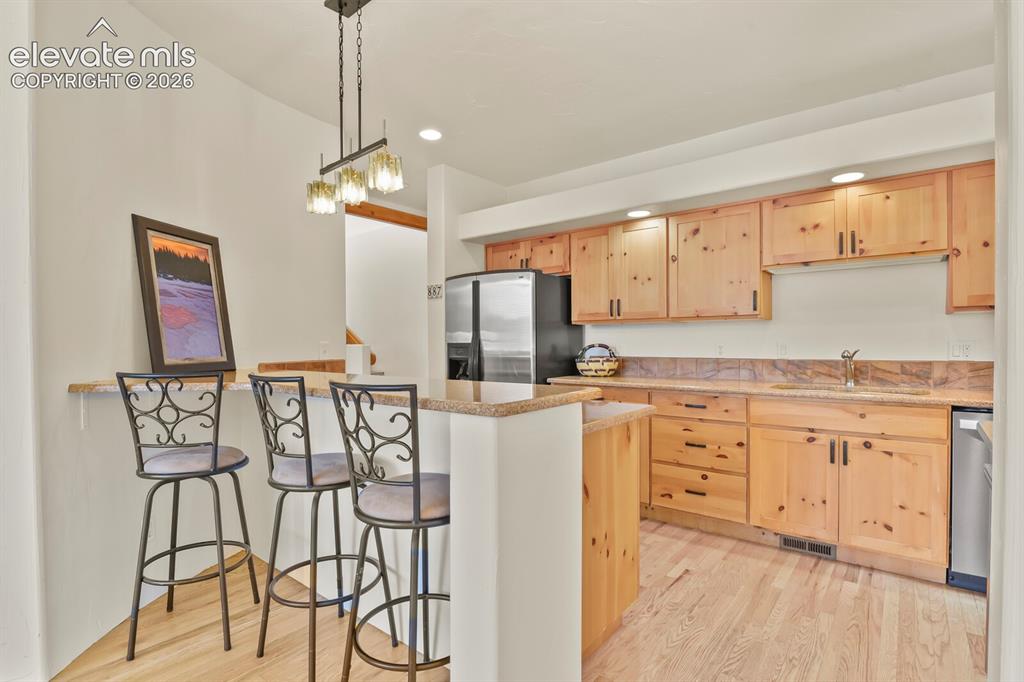 Image 9 of 39: Knotty pine cabinetry