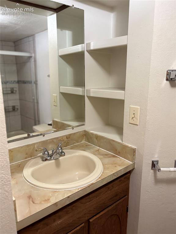 Image 14 of 23: Nice storage area by sink