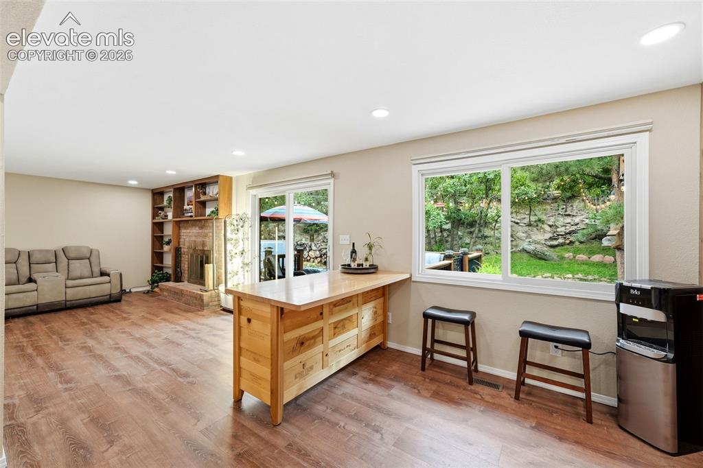 Image 10 of 42: Movable island, big windows and walkout to the back deck