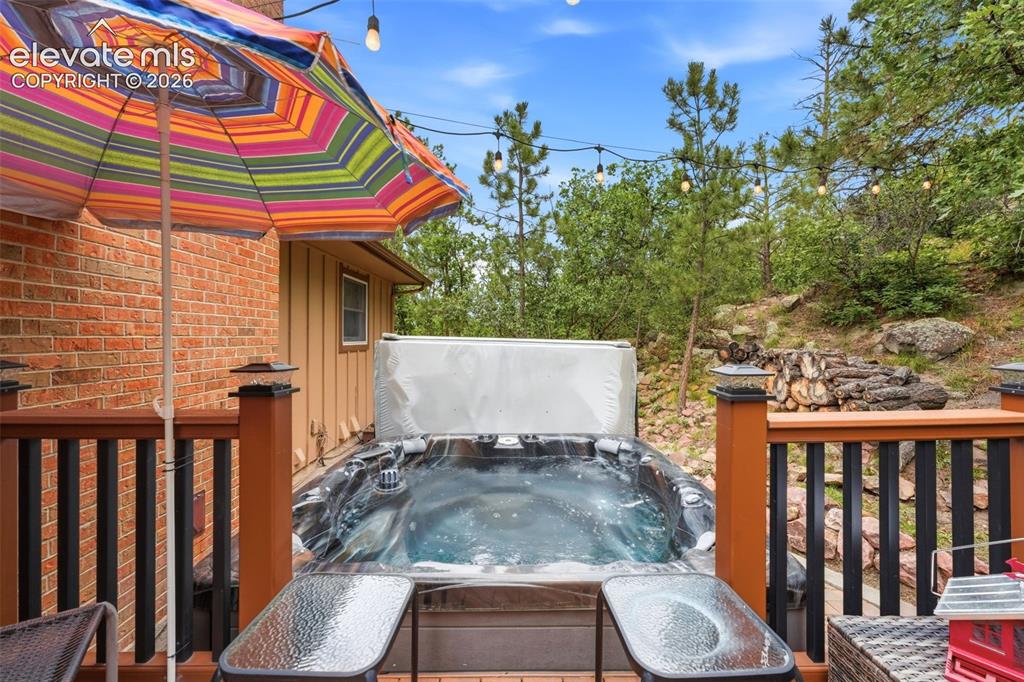 Image 16 of 42: Hot tub in back yard is included! Perfect for apres ski