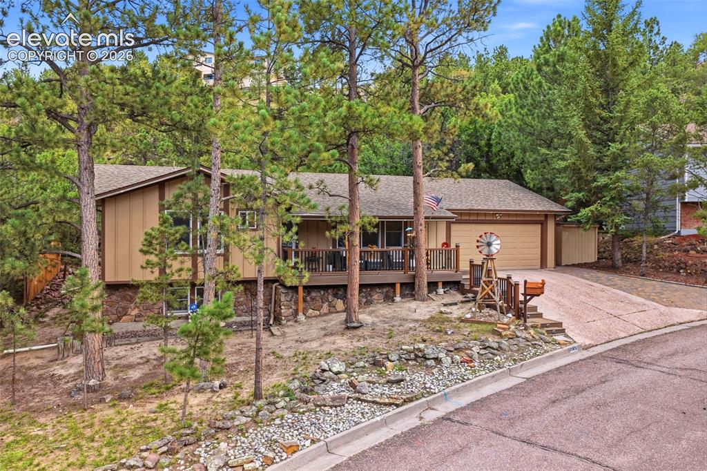 Image 2 of 42: Treed .45 acre lot convenient proximity to shopping, dining, UCCS, I-25, an