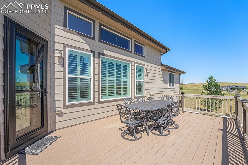Image 36 of 48: Wooden deck featuring outdoor dining space