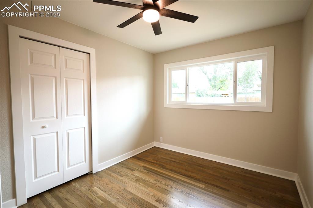 Image 18 of 27: Unfurnished bedroom featuring dark wood finished floors, a closet, and ceil