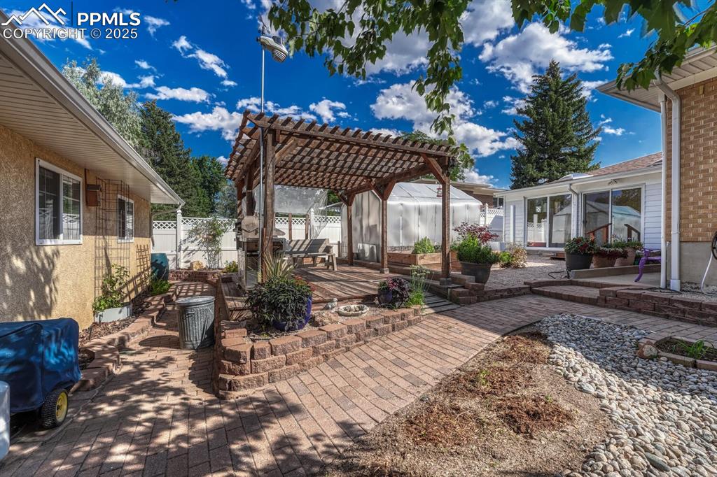 Image 44 of 50: Pergola with included gas grill