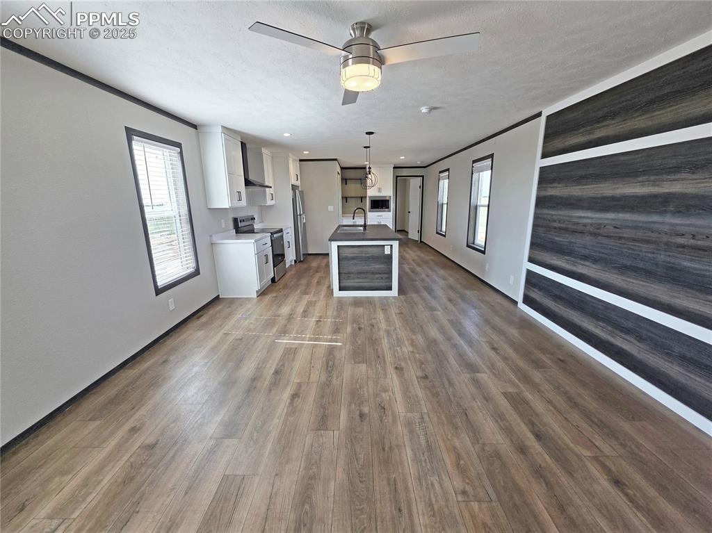 Image 8 of 30: Kitchen and Living Room - Photo of  Model
Home.